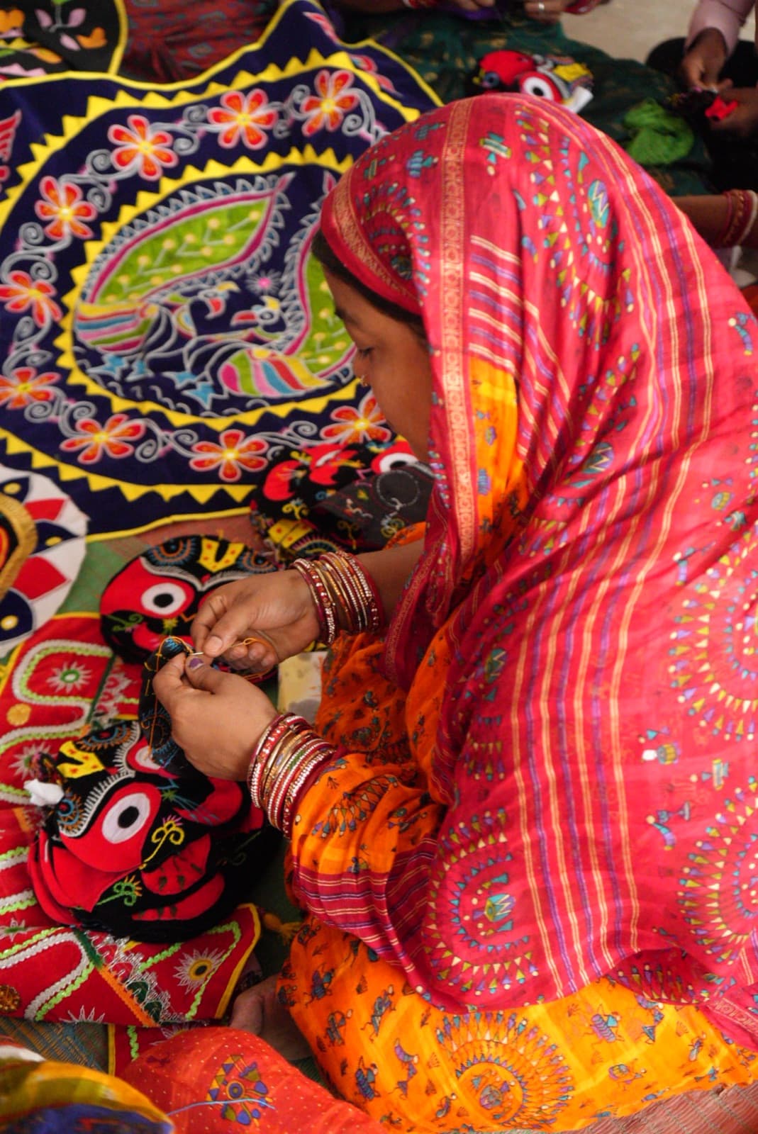 Artisan creating traditional applique craft